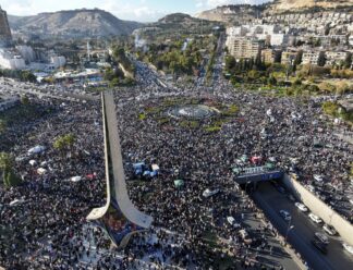 Syria Syrians gather during a celebratory demonstration following the first Friday prayers since Bashar Assad's ouster, in Damascus' central square, Syria, Friday, Dec. 13, 2024. (AP Photo/Ghaith Alsayed)